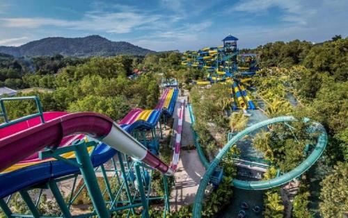 a roller coaster at a theme park at FERRINGHI HOUSE with POOL, BBQ SET, 5 MINUTES WALK to BEACH in Batu Ferringhi