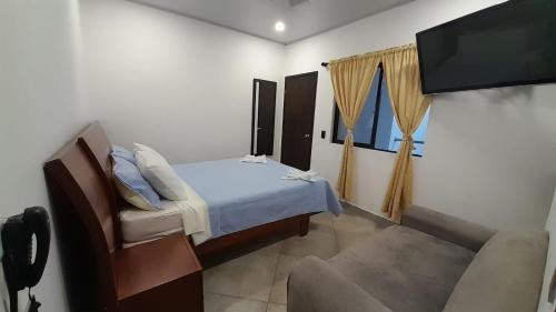 Katara Boutique Hotel tesisinde bir odada yatak veya yataklar