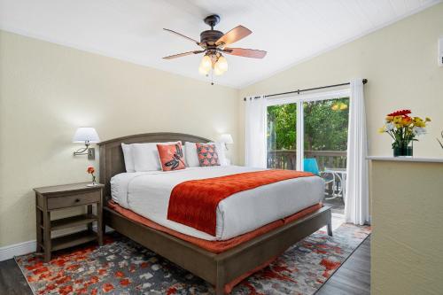 a bedroom with a bed and a ceiling fan at Bay Harbor Lodge in Key Largo