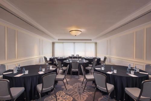 a conference room with tables and chairs in it at Lisbon Marriott Hotel in Lisbon