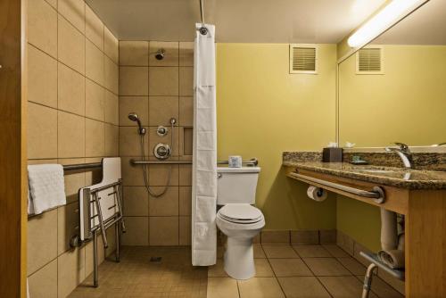 a bathroom with a toilet and a sink and a shower at Best Western The Plaza Hotel Honolulu Airport - Free Breakfast in Honolulu