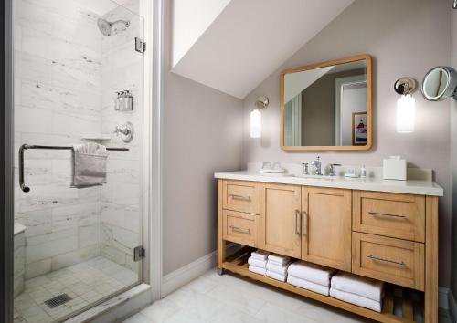 a bathroom with a sink and a shower at Beach Village at The Del, Curio Collection by Hilton in San Diego