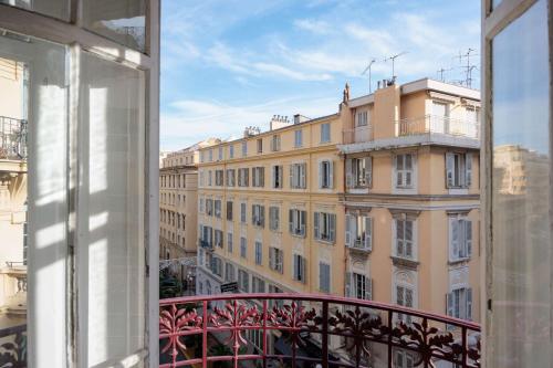a view of a large building from a window at Best Western Plus Hôtel Massena Nice in Nice