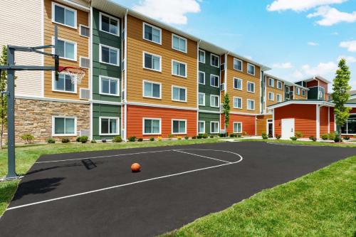 a basketball court in front of a building at Residence Inn by Marriott New Haven Hamden in Hamden
