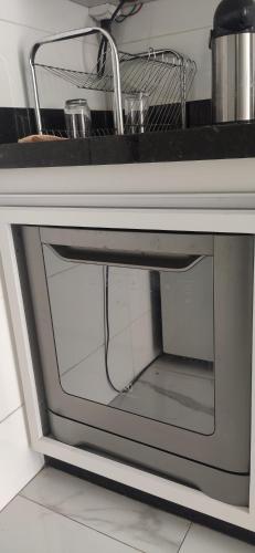Η κουζίνα ή μικρή κουζίνα στο Apartamento inteiro com área e garagem privativa