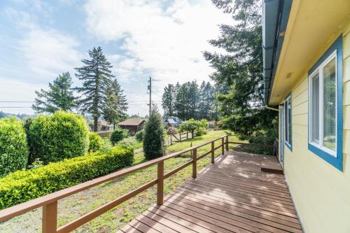a wooden walkway next to a house at Lees Place in Neotsu