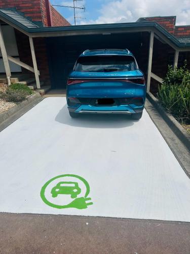a car parked in front of a house with a handicapped parking lot at Warragul Views Motor Inn in Warragul