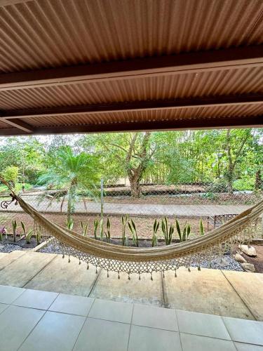 a hammock in the middle of a patio at Cabañas Quebrada del Pueblo in Dolega