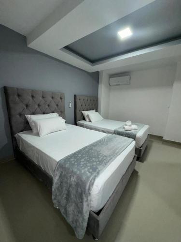 two beds in a room with two beds sidx sidx sidx sidx at 110 Loft in Cali