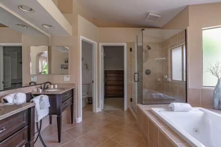 a large bathroom with a tub and a shower at Escape to Carmel Valley Tranquil Outdoor Space in San Diego
