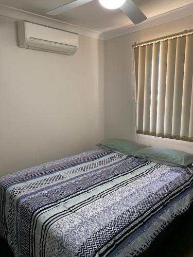 מיטה או מיטות בחדר ב-Grace Guest Rooms