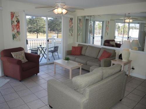 a living room with a couch and chairs and a table at Golf Resort Villa 2607 with Outdoor Pool in Calabash