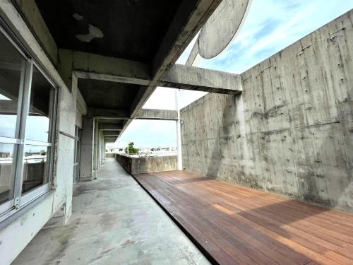 an empty balcony of a building with a wooden floor at LivingAnywhere Commonsうるま 4bed room - Vacation STAY 65070v in Uruma