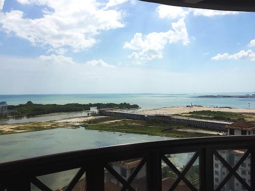 a view of the beach and the ocean from a balcony at Seanest Residence 贤巢民宿 18 "Owned by Amadel Residence" in Melaka