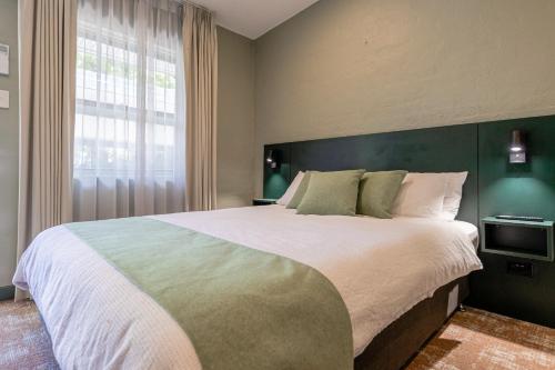 Cama o camas de una habitación en Everton Park Hotel
