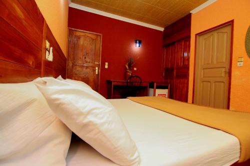 Postel nebo postele na pokoji v ubytování Hotel Le Prince