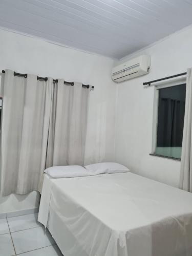 Llit o llits en una habitació de Casapraiacururupe