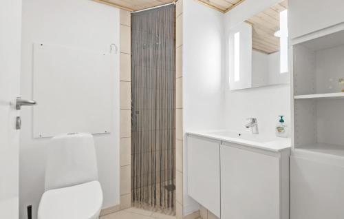 a white bathroom with a shower and a sink at Beautiful Apartment In Fan With Kitchen in Fanø