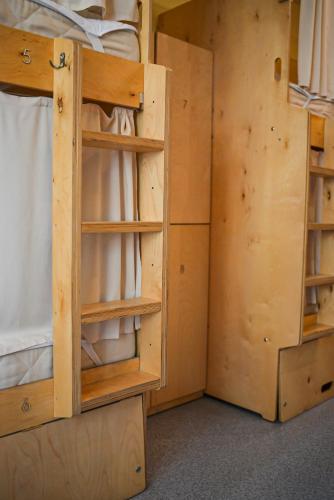a bedroom with a bunk bed and a closet at Hostel Forum in Astana