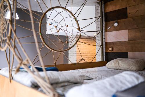 a room with a bed with a net at Hostel Forum in Astana