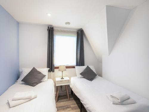 Posteľ alebo postele v izbe v ubytovaní Lodge 6, Invergarry Lodges