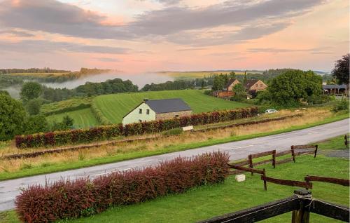 a country road with a white house and a farm at Stunning Home In Vresse-Sur-Semois in Vresse-sur-Semois