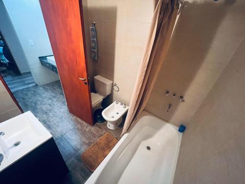 a bathroom with a toilet and a sink and a shower at Alojamientos Premiun Centro in Termas de Río Hondo