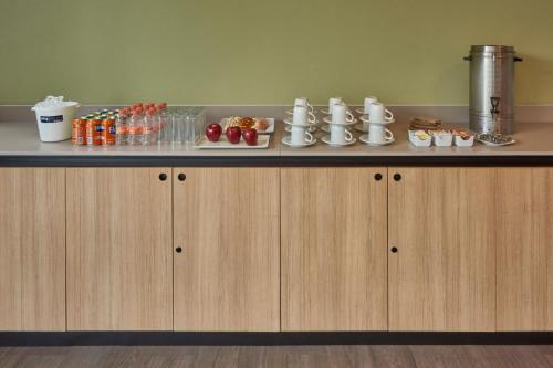 a counter with food and drinks on top of it at City Express Plus by Marriott Ciudad de México Mundo E in Mexico City