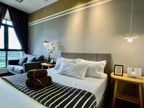 a hotel room with a bed and a couch at Near Airport K Avenue Family Room in Donggongon