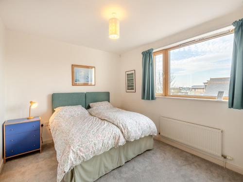 a bedroom with a bed and a window at Seaview in Parkeston