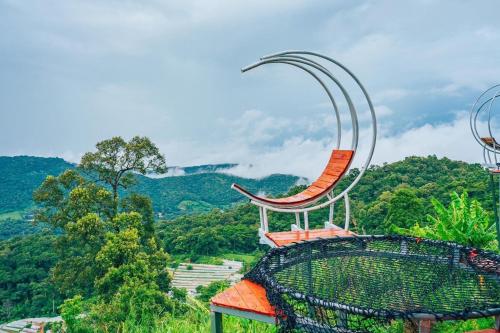 a chair on the top of a roller coaster at ไร่ดอยช้าง ม่อนเเจ่ม in Mon Jam