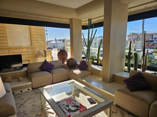 a living room with couches and a coffee table at Hotel San Francisco in Viareggio