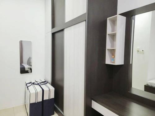 a bathroom with a black and white wall at Tambun lost world luxury villa 5BR/20 pax/mahjong/karaok/bbq/garden events in Tambun