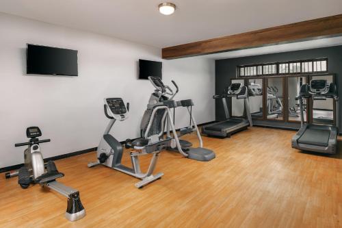 a gym with treadmills and exercise bikes in a room at Delta Hotels by Marriott Dar es Salaam in Dar es Salaam
