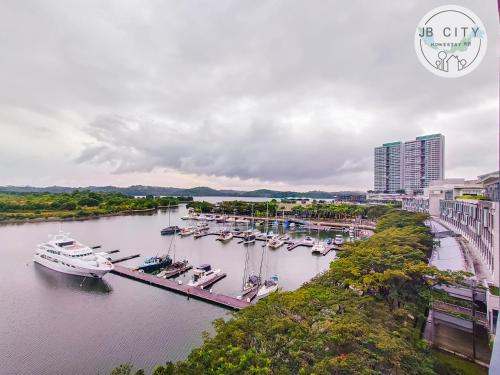 an aerial view of a marina with boats in the water at Puteri Harbour by RR JBcity in Nusajaya