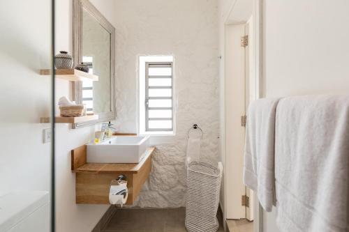 a bathroom with a sink and a mirror at Charming 3-Bedroom Villa with Pool in Grand Baie in Grand Baie