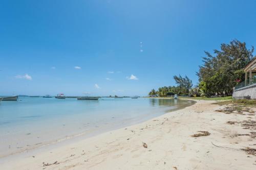 a view of the beach from the shore at Quaint 4-bedroom Beach Villa in a fishing village in Grand Gaube