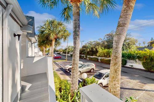 a view from the balcony of a house with palm trees at Sparks & Sunshine in Cape Canaveral