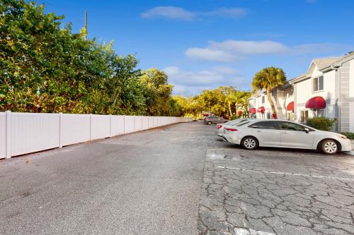 a car parked in a parking lot next to a fence at Sparks & Sunshine in Cape Canaveral