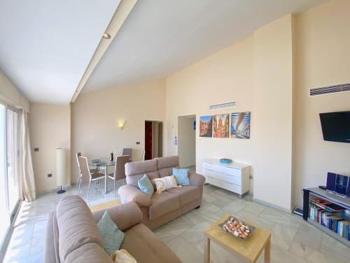 A television and/or entertainment centre at Benalmadena Harbour Penthouse with big terrace and sea view