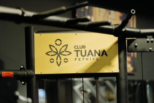 a sign that reads club tzuza fethrine at Club Tuana Fethiye - All Inclusive in Fethiye