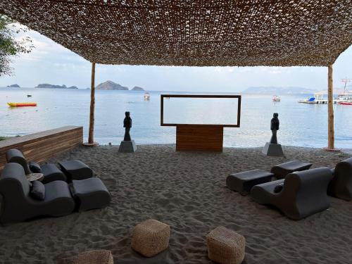 a stage with a white screen in front of the water at Club Tuana Fethiye - All Inclusive in Fethiye