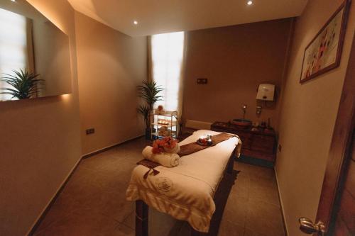 a room with a hospital bed with two stuffed animals on it at Club Tuana Fethiye - All Inclusive in Fethiye