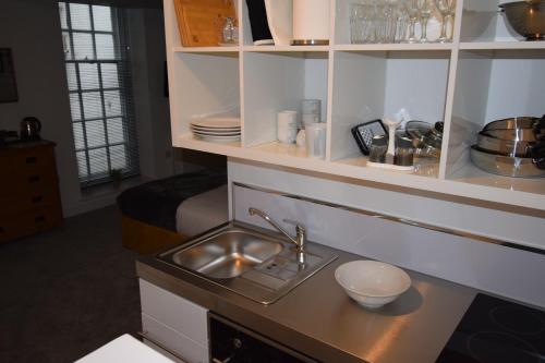 a kitchen with a sink and a counter top at 9 Plants Yard in Worksop