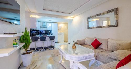 a living room with a couch and a table at AiM HOUSE in Marrakech