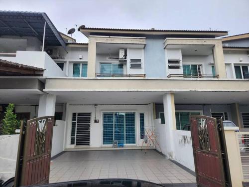 a house with a gate in front of it at IPOH BOTANI bauhaus 17pax/4BR/mahjong/tv box in Ipoh
