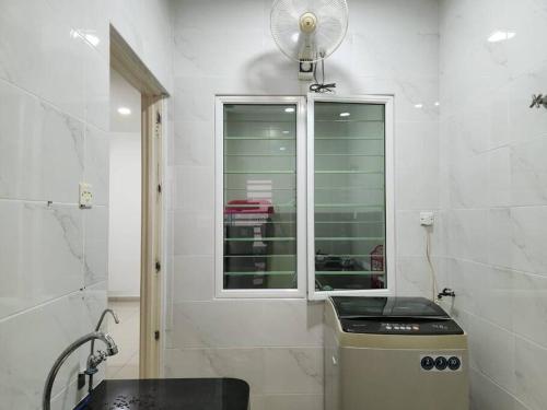 a white bathroom with a sink and a window at IPOH BOTANI bauhaus 17pax/4BR/mahjong/tv box in Ipoh
