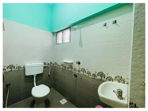 Koupelna v ubytování Udhayam Residency