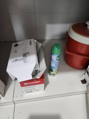 a box and a can on top of a refrigerator at IPOH BOTANI bauhaus 17pax/4BR/mahjong/tv box in Ipoh