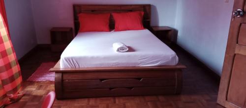 Postel nebo postele na pokoji v ubytování Nofiko Auberge